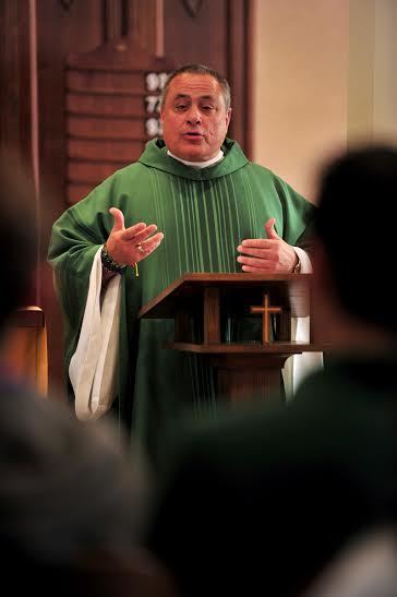 Fr Joe Corpora gives a homily during Mass