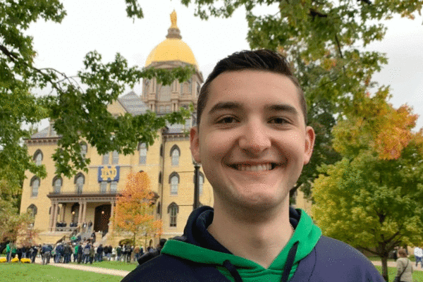 Ryan Murray poses in front of Notre Dame Main Building