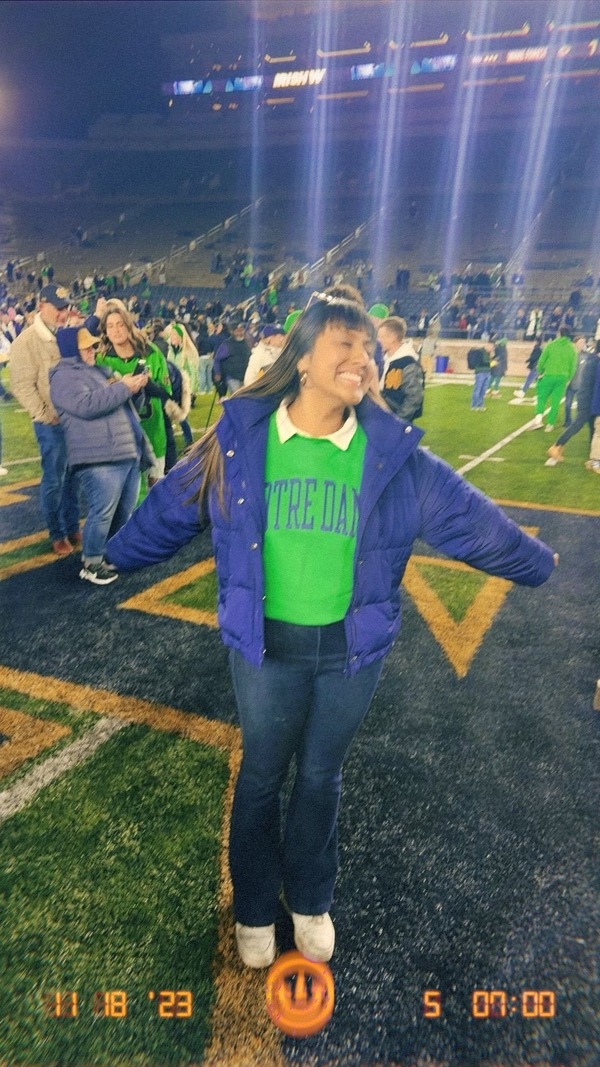 Lulu Romero on the field of Notre Dame Stadium.