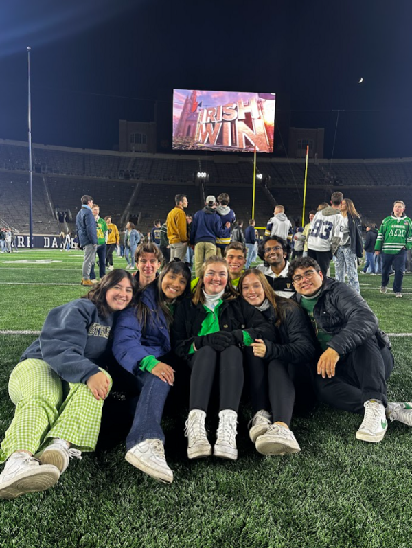 Lulu Romero poses with a group of friends at Notre Dame Stadium.