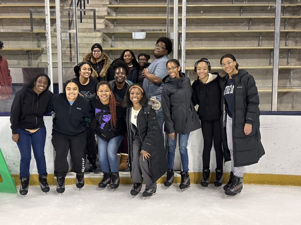 Luzolo Mantundo poses with a group of friends at Compton Ice Arena.
