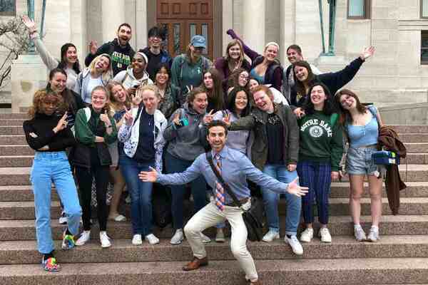 Professor Mike Macaluso poses with a group of Notre Dame students.