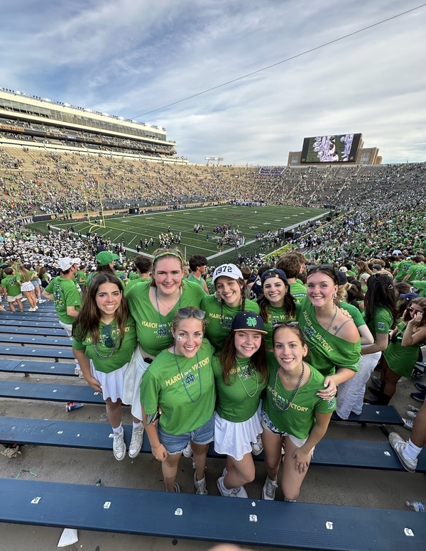 Cheyenne Stewart '26 poses with a group of friends in Notre Dame stadium.