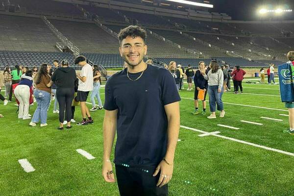 Mark Metryoos '25 stands on field at Notre Dame stadium.