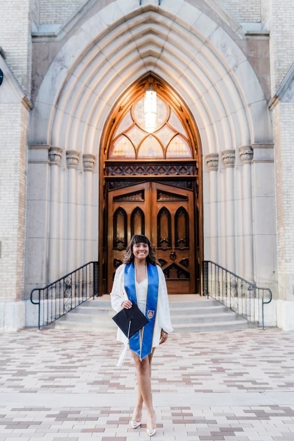 Luisa Romero '24 poses in front of the Notre Dame Basilica.