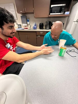 Taking a break during our shift at 
Memorial and getting our palms read by our friend Raoof